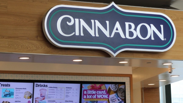 Cinnabon sign and in-store digital menu