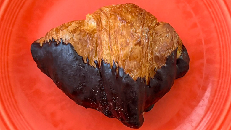A chocolate-dipped Croissant from Paris Baguette on plate