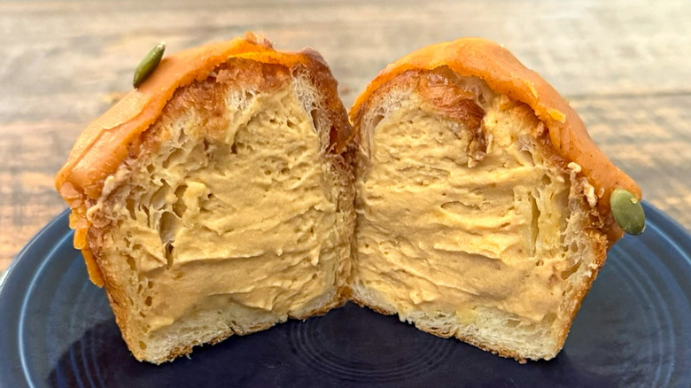 A pumpkin spice cruffin from Paris Baguette split open on plate