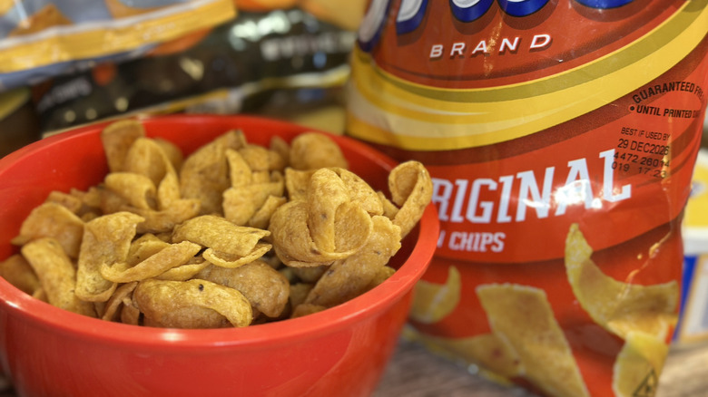 Fritos original corn chips in red bowl with product bag in background