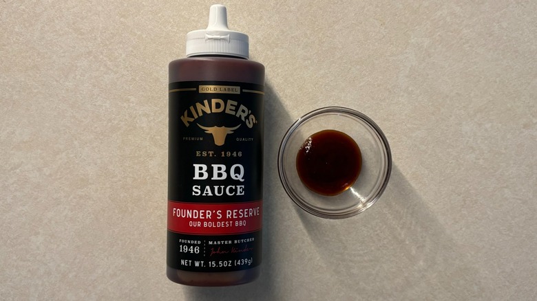 Kinder's Gold Label Founder's Reserve BBQ Sauce bottle and sauce in glass ramekin