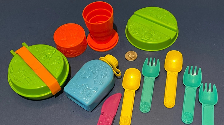 A selection of colorful plastic picnic tools