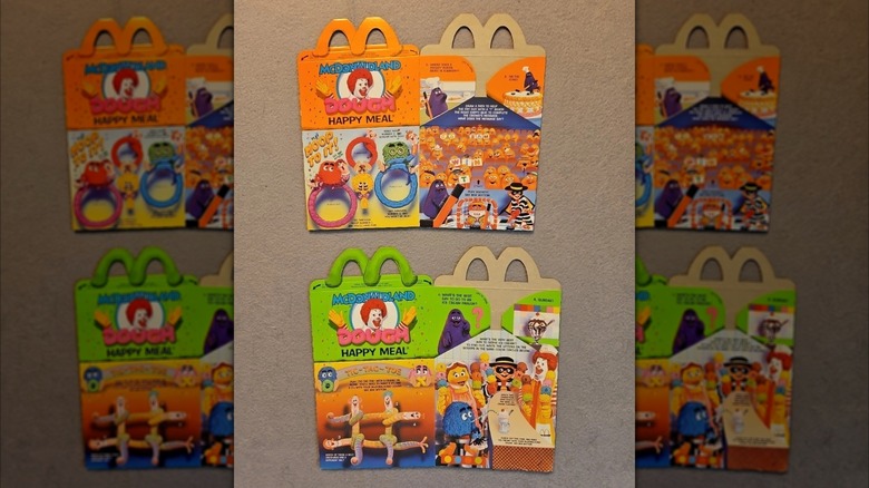 Two vintage Happy Meal boxes advertising a McDonaldLand Dough toy