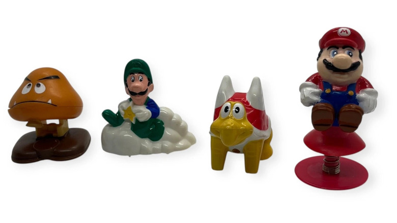 Mario Brothers figurines, including a jumping Mario