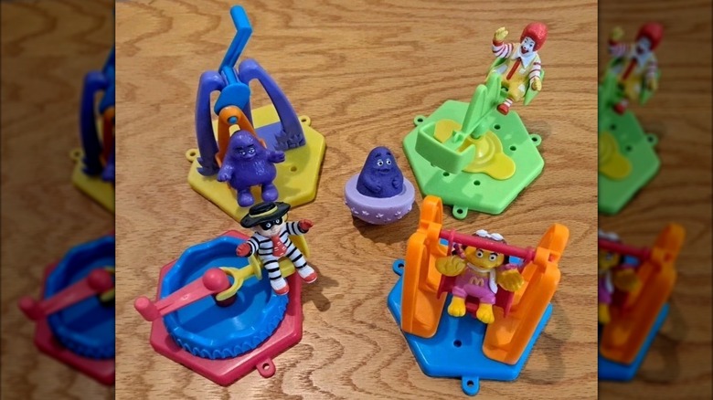 A set of bright, McDonald's themed toys in the style of a carnival featuring Ronald McDonald and friends