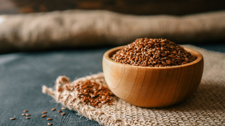 Flax seeds in a small wooden bowl