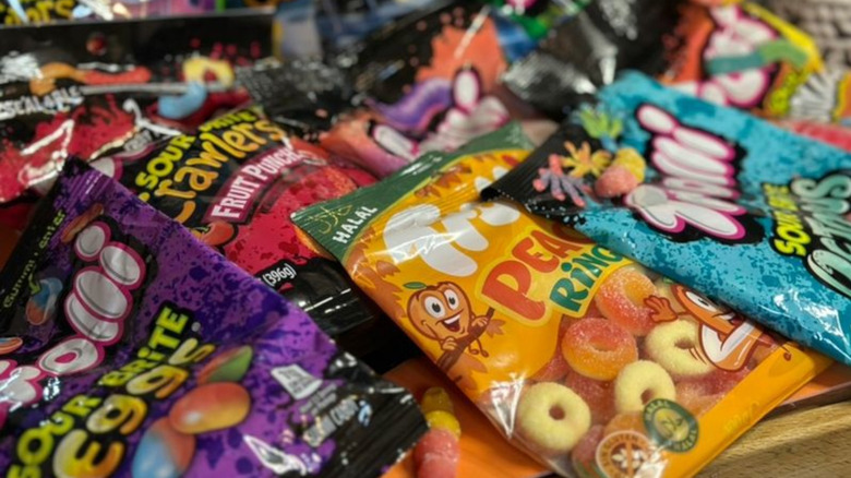 Several packets of Trolli brand candies