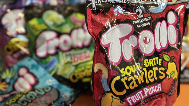 Close up of Trolli Sour Brite Crawlers Fruit Punch with other Trolli brands blurred in background
