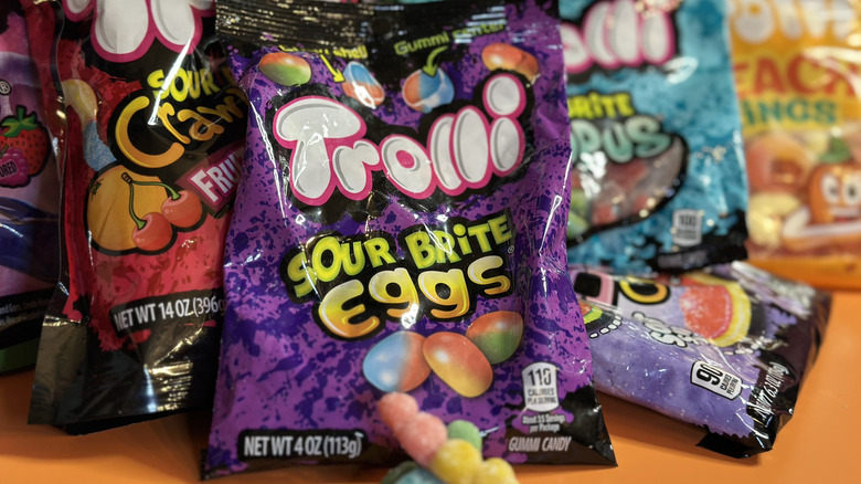 Close up of Trolli Sour Brite Eggs packaging in front of other Trolli brands