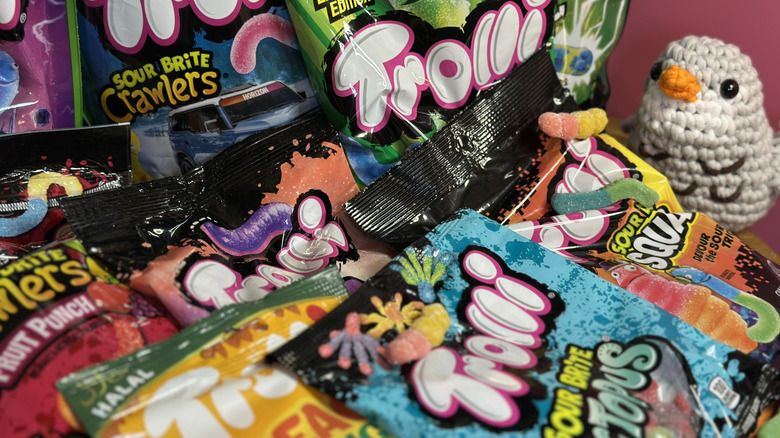 Several packets of Trolli brand candies