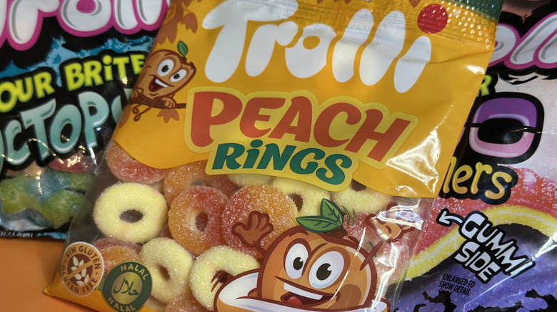 Close up of Trolli Peach Rings on top of other Trolli candies