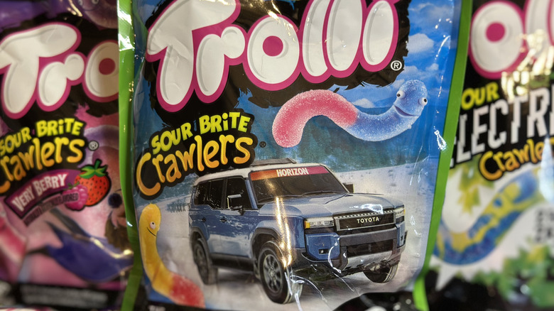 Trolli Sour Brite Crawlers (Original) with other candy packages in background