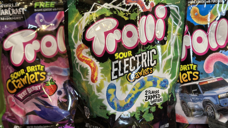 Trolli Sour Electric Crawlers in close up with two other flavors on each side