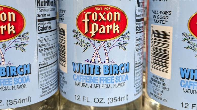 Close up of light blue label on bottles of Foxon Park white birch soda