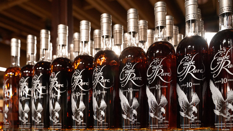 Lots of bottles of Kentucky bourbon on a store shelf