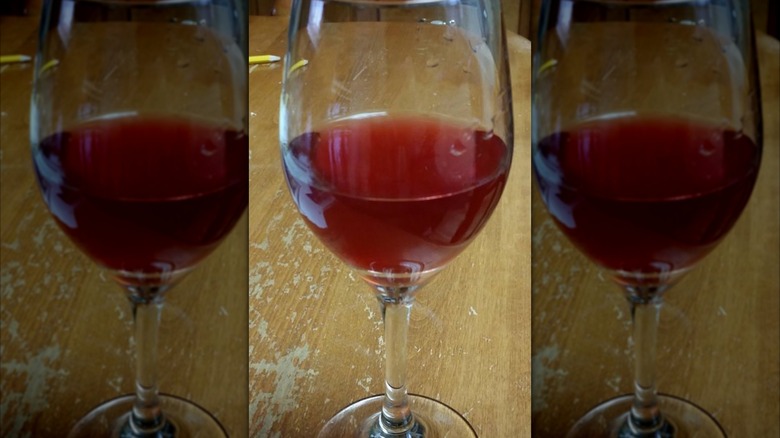 A glass of chokecherry wine