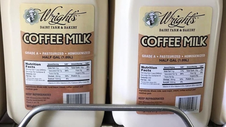 Plastic containers of pre-made coffee milk with labels