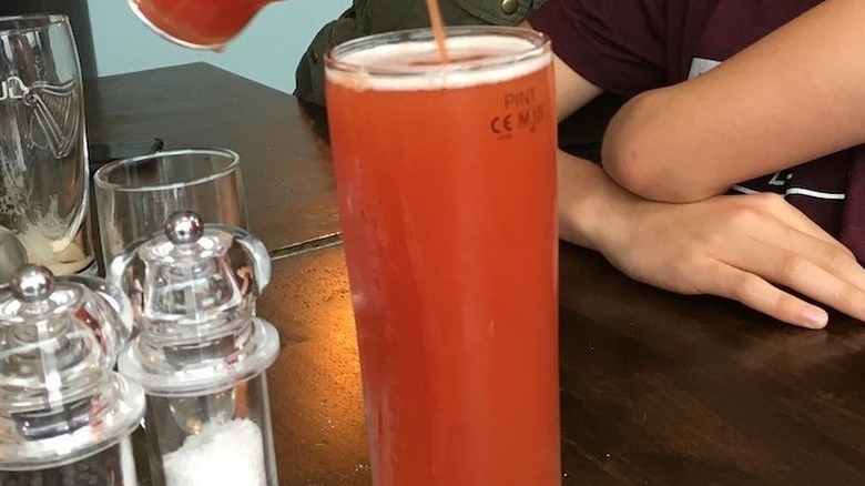 A glass of tomato juice mixed with beer