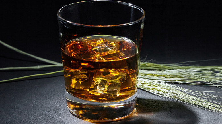 A glass of rye whiskey with rye