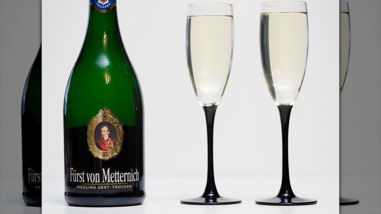 A bottle and two glasses of Sekt wine