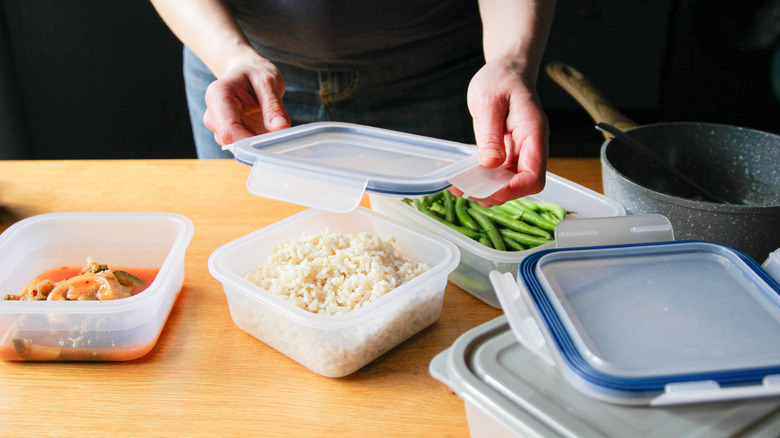 Leftover rice in a Tupperware on a kitchen counter