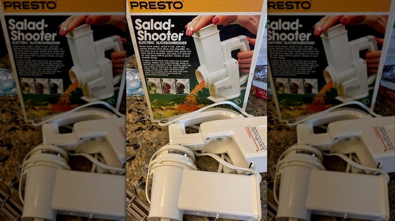 A Salad Shooter in front of its box.