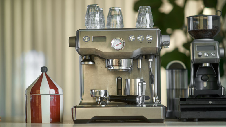 Modern espresso machine brewing a cup of coffee in a stylish kitchen