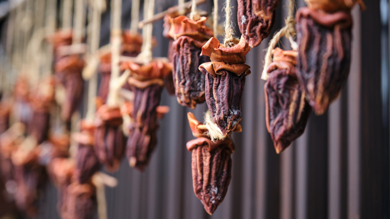 Persimmons drying on a string