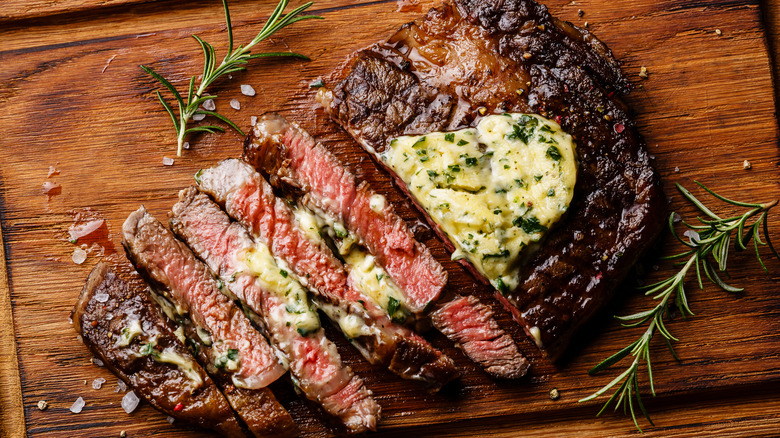 Sliced ribeye on a cutting board