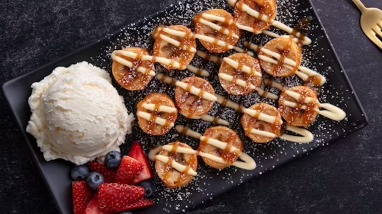 P.F. Chang's banana spring roll dessert plated with ice cream and berries