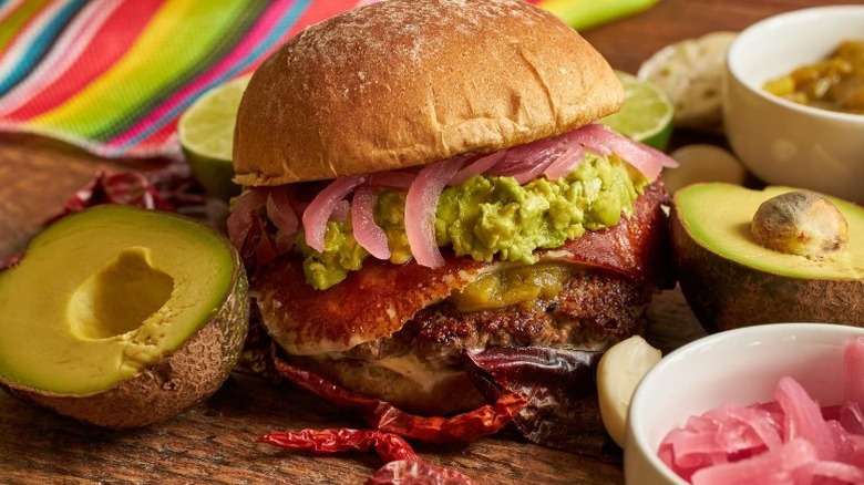 burger with bacon, avocado, and onions
