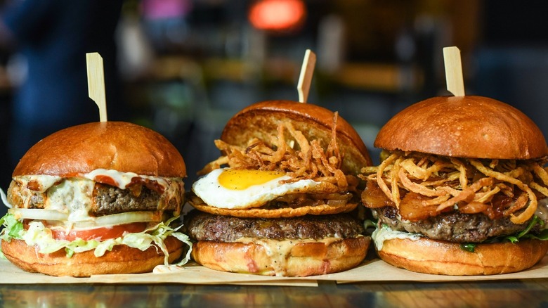 three burgers from Hopdoddy Burger Bar