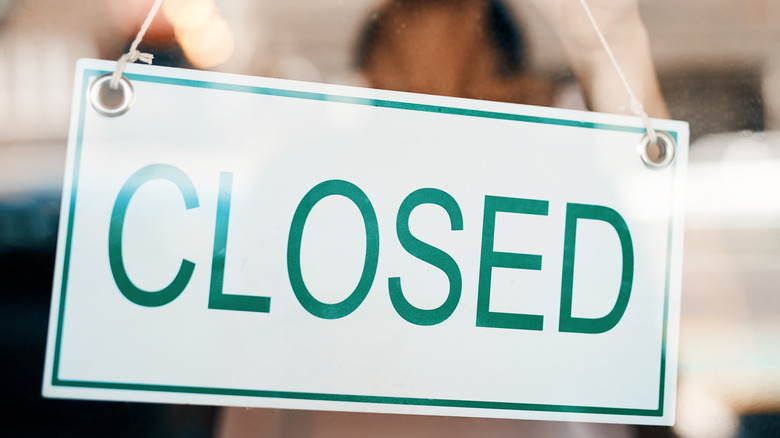 "Closed" sign hanging on door