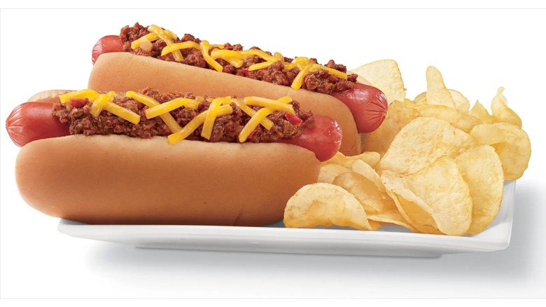 Chili dogs next to chips