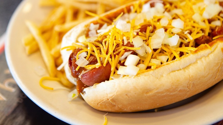 Steak 'n Shake chili dog on plate with fries 