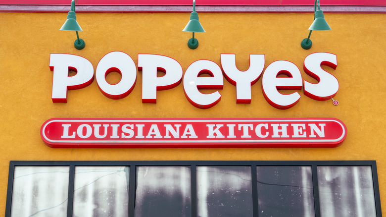 The sign on the exterior of a Popeyes location.