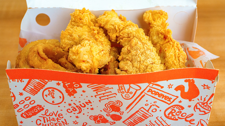 A box of chicken strips from Popeyes