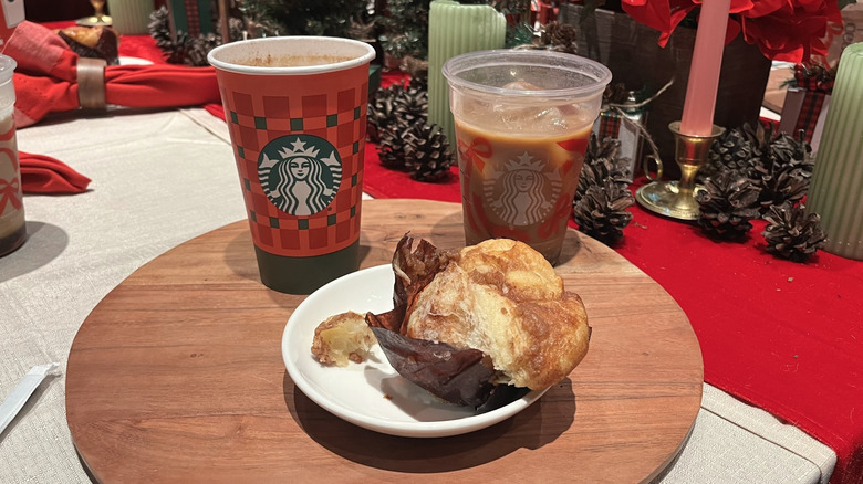 Starbucks Holiday hot and cold drinks with a cinnamon pull-apart bun in the foreground