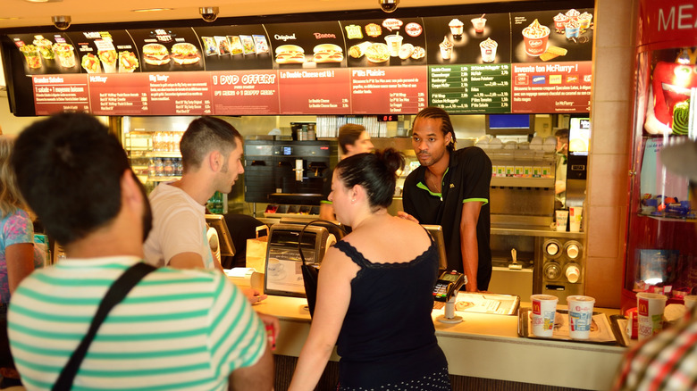 People ordering food at a McDonald's in Nice, France