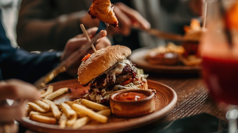 A burger and fries served at a restaurant.