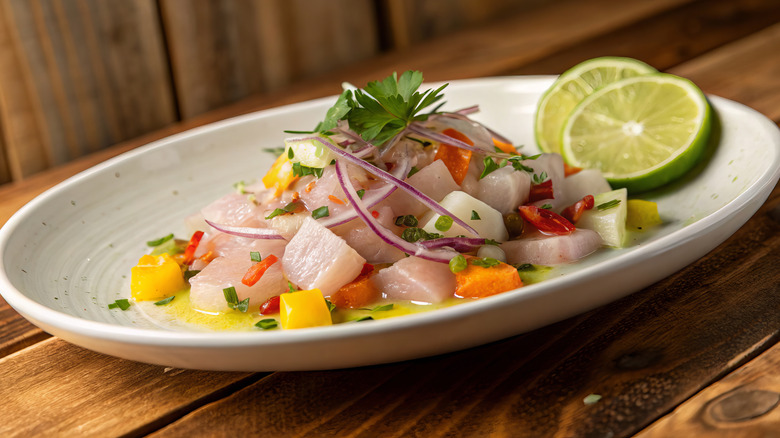 Plate of Peruvian ceviche with lime slices