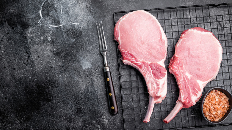 Uncooked pork chops.