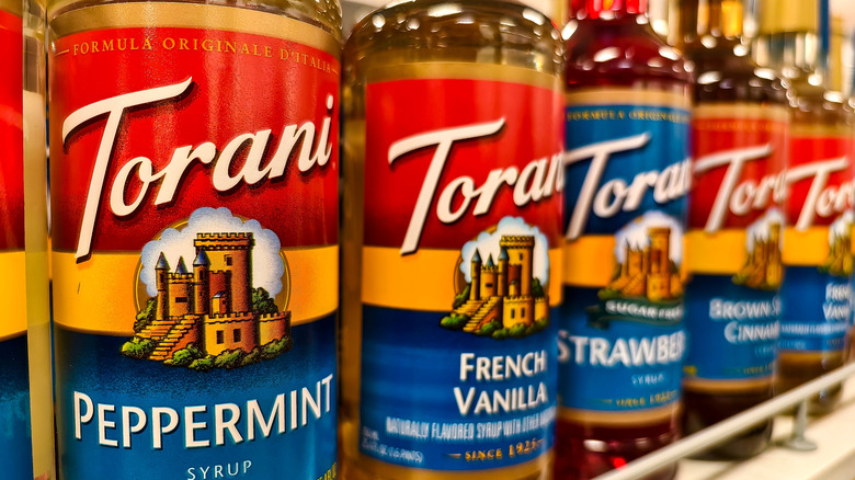 shelf with Torani bottles
