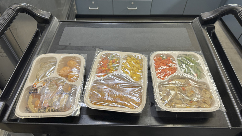 Packaged meals on a tray in a prison