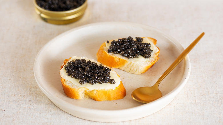Caviar on bread on plate