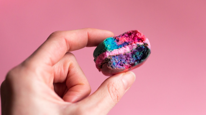 Multi-colored macaron with bite taken out