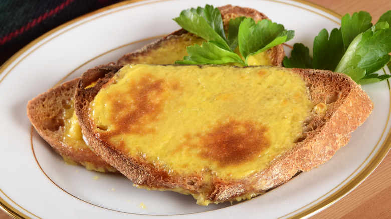Welsh rarebit on plate with garnish