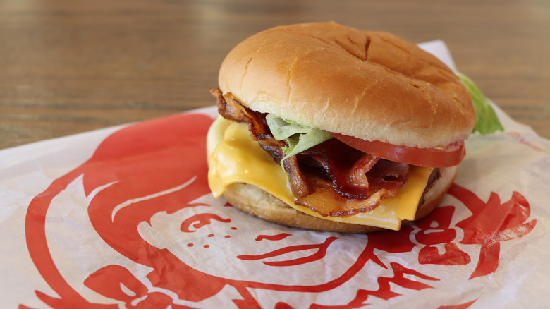 Wendy's Junior Bacon Cheeseburger on company tissue