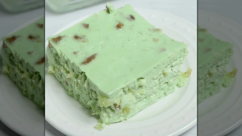 Lime cottage cheese vintage JELL-O salad square on white plate