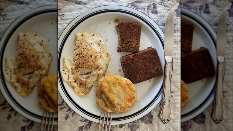 Southern breakfast plate with fried livermush fried egg and butter biscuit